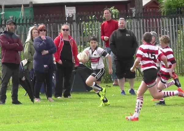 Ben Conner makes a break for Panthers Under-12s