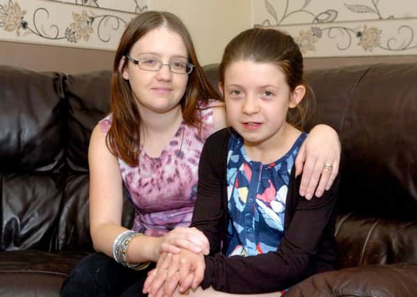 Jessica Mulholland, pictured with her mother Laura in 2012, needs help getting to her school prom