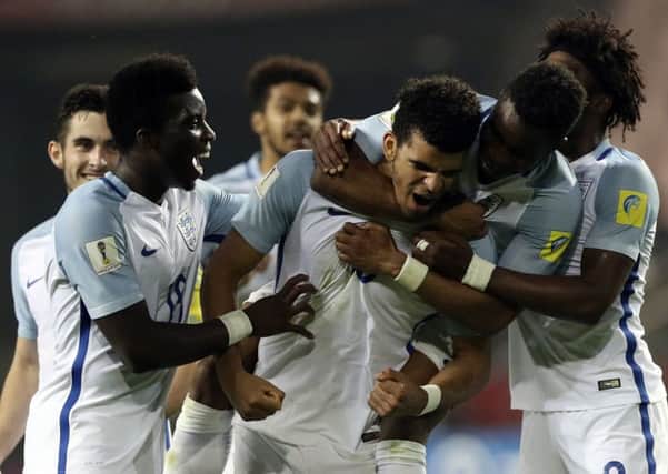 England's Dominic Solanke, centre, celebrates his goal against Italy.