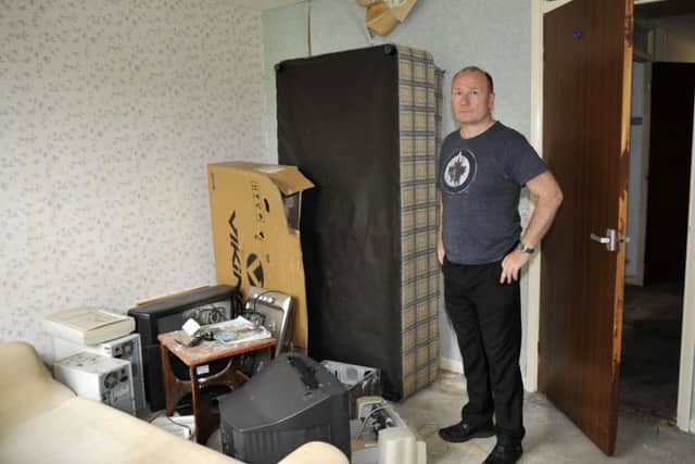 Mark Chadwick in his flat on Mark Close, Penwortham