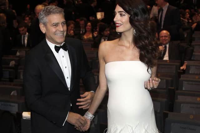 George and Amal Clooney who have had twins