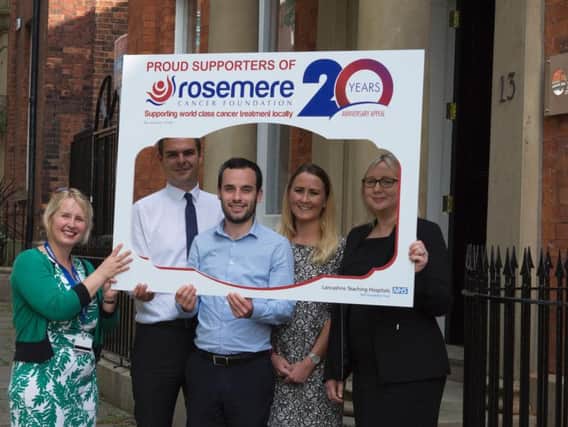 Rosemere Cancer Foundations Cathy Skidmore, far left, puts Farleys associate partner Stephen Greenwood, solicitor Alex Singer, trainee solicitor Natalie Fitzmaurice and associate partner Sian Hall in the frame for its support of the charitys 20 Years Anniversary Appeal