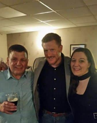 Tony and Steph Cartwright enjoy the St Catherine's Hospice charity night with a footballer