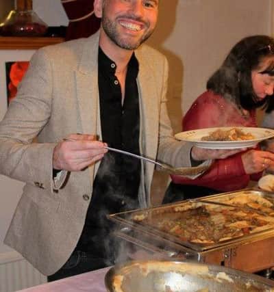 Dean Edwards enjoys some hot pot at the St Catherine's Hospice fund-raiser