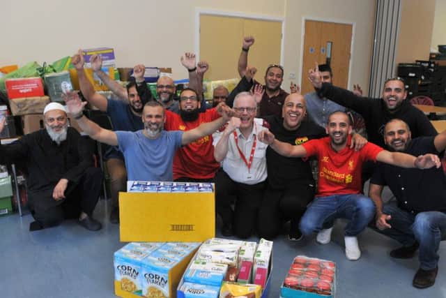 Photo Neil Cross
The Muslim community in Preston deliver goods to the depleted Salvation Army food bank