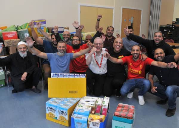 Photo Neil Cross
The Muslim community in Preston deliver goods to the depleted Salvation Army food bank