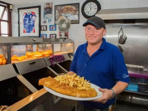 John Haggerston, 37, the owner of Casey's Fish Shop in Ossett, West Yorks. Casey's serves what they claim to be the UK's biggest fish and chips, consisting of a huge side of battered fish, a massive portion of chips, four sides and a bread bap. Pic Benjamin Paul / SWNS.com
