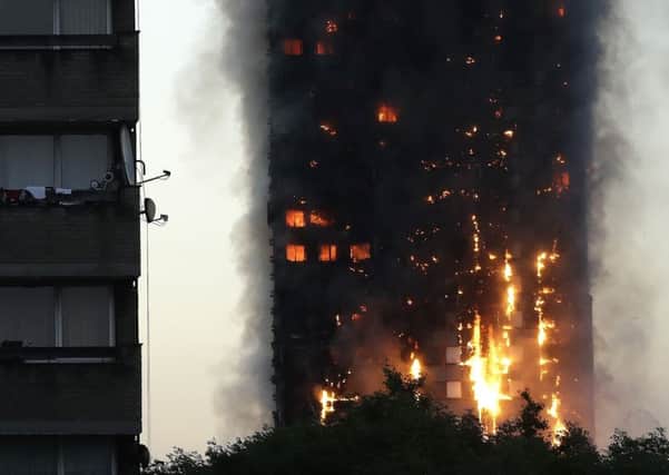 Smoke and flames billowing from Grenfell Tower, London