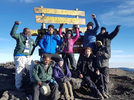 A team, including Lantei Compliance Services co-founder, Leona Smith and managing director, Andrew Livesey, at the top of Mount Kilimanjaro