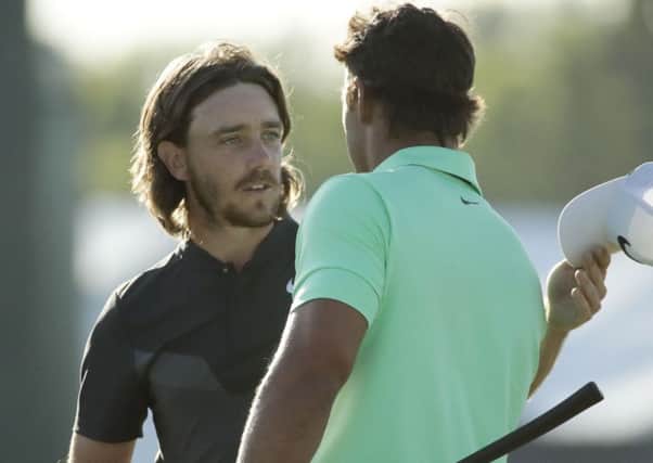 Brooks Koepka shakes hands with Tommy Fleetwood (left)