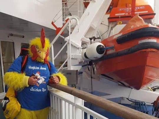 James Hamilton dressed as a chicken on a boat to Plymouth