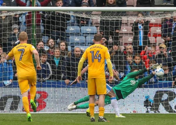 Chris Maxwell saves a penalty from Huddersfield Town's Aaron Mooy last season
