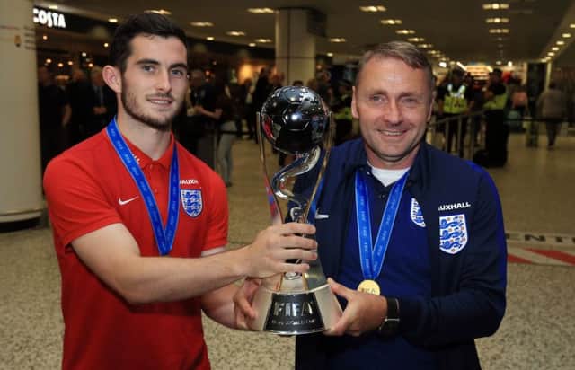 England U20's manager Paul Simpson and captain Lewis Cook (left)  with the World Cup.