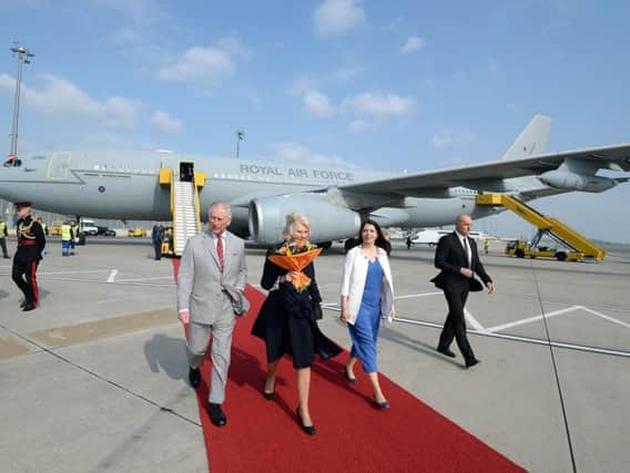 Prince of Wales and Duchess of Cornwall arriving in Vienna, Austria, with an RAF Voyager A330 in background