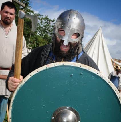Heysham Viking Festival. Ulfrich Vaskrson practices his battle cry.