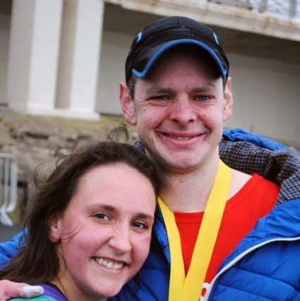 Ben Ashworth with wife Louise after completing a Blackpool Marathon