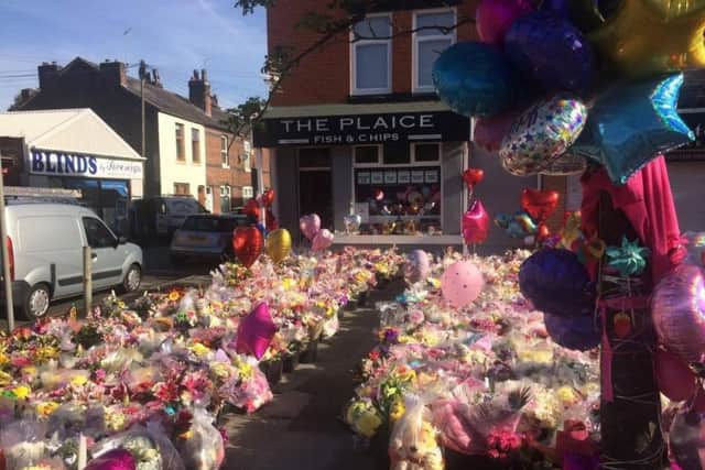 Tributes outside The Plaice, where the Roussos family work
