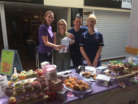Staff at the neonatal unit in Preston with Danielle Sowerby and her baby Marnie at a fund-raiser at Royal Preston Hospital