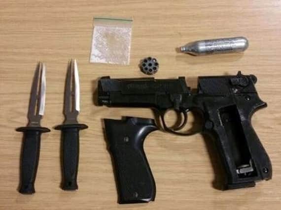 Police uncovered weapons and drugs in the search