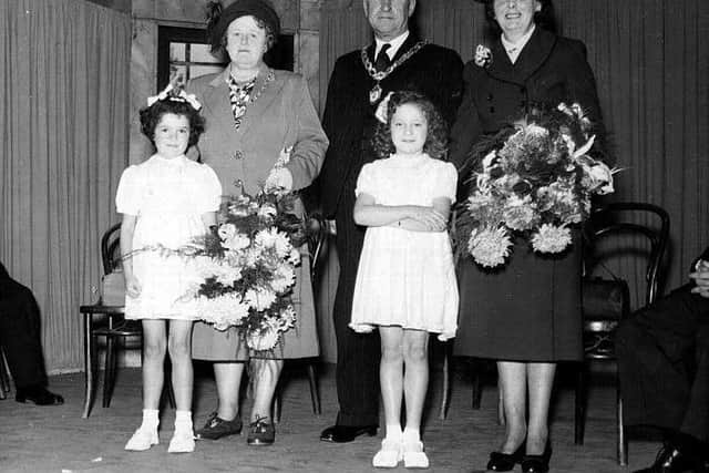 Pam Ward with Hazel Mcguinness stood in front of the Mayor and Mayoress at the Chamber of Trade exhibition at Leyland public hall in 1950