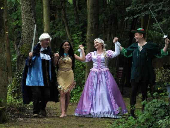 Derian House staff Richard Duckett and John Rullo (as Robin Hood) with Hiawatha and Rapunzel, from Pop Up Princesses who support the work of Derian House Childrens Hospice.