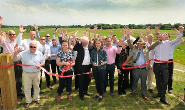 Photo Neil Cross
Emma Howard Boyd cuts the ribbon at the official opening of Â£7 million Croston Flood Risk Management Scheme