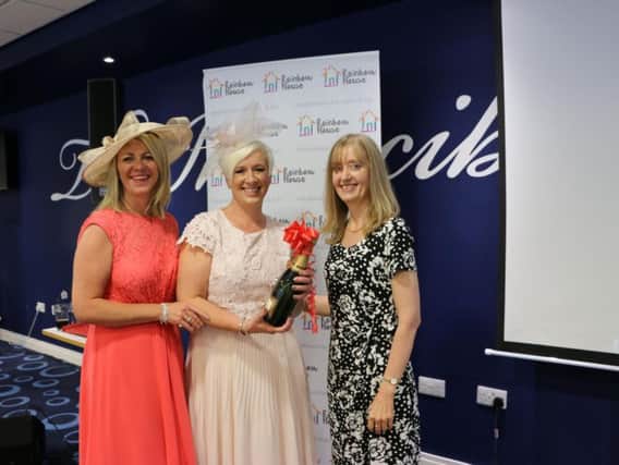 Best Dressed Filly winner Sharon Blake (centre) with Nicola Parkinson (left) and Susan Standrig from Farington Lodge at Ladies Day for Rainbow House