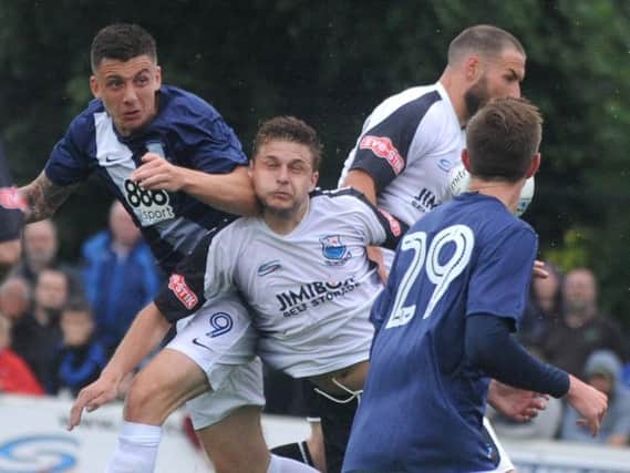 Jordan Hugill in the thick of the action against Bamber Bridge