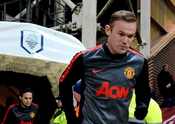 Rooney runs out at Deepdale before an FA Cup tie between United and Preston in February 2015