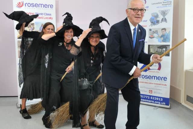 Photo Neil Cross.  Marina McHugh, Kath Hodson and Carol Bagshaw, Witches of Adlington with Dennis Benson, chairman of the Rosemere Cancer Unit
