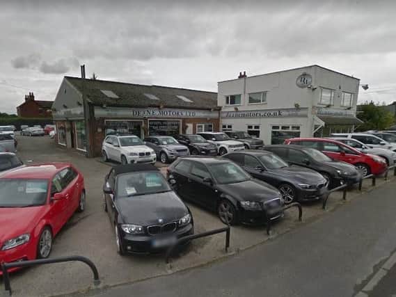 A man was arrested in Chorley in the early hours of this morning after he was allegedly seen interfering with motor vehicles at a car dealers, say police.