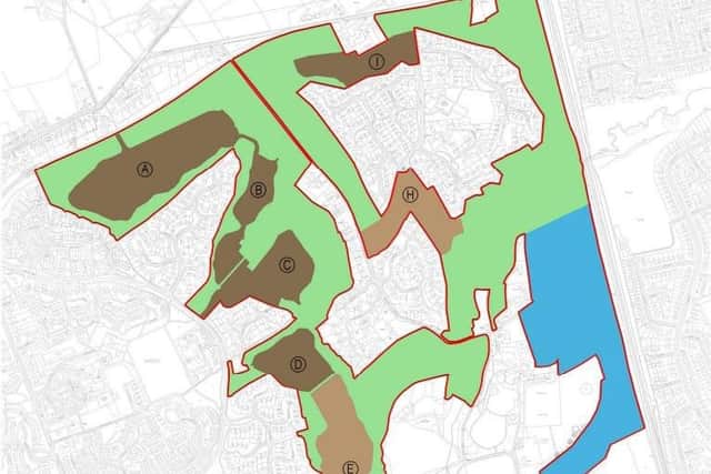 A development overview with the housing in brown, public land in green and training ground in blue