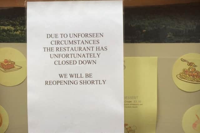 Sign on the door of Tiggis restaurant