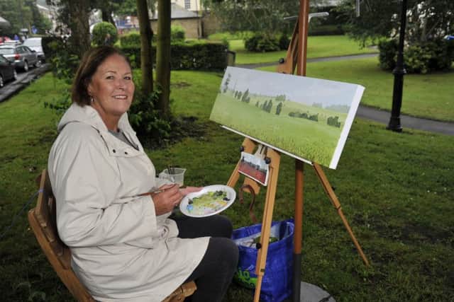 Kathleen Ashall from Longridge paints a poppy field in Townley Gardens at the 'Create Longridge' art festival