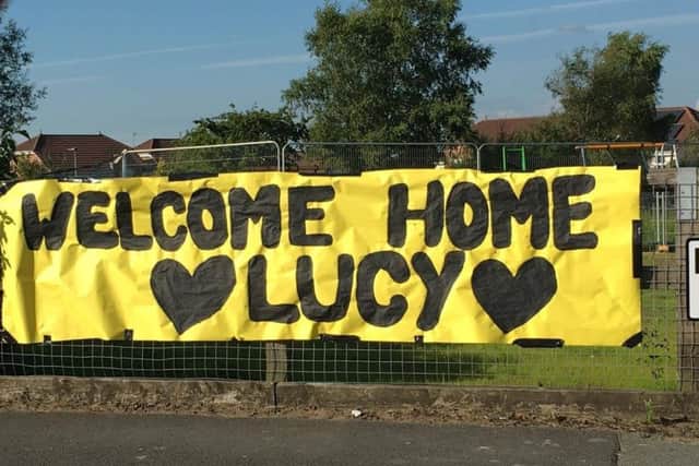 A banner near Lucy's home in Standish to welcome her home