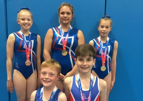 The successful Jump UK trampolinists - back row; Amy Pickering, Megan Davies, Lucy Moores. Front row, Henry Barnes and Will Fothergill.
