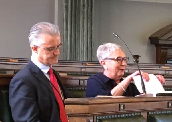 Coun Paul Greenall pictured moments after resigning from the Tory group at County hall  and moving to sit next to Independent Councillor Liz Oades