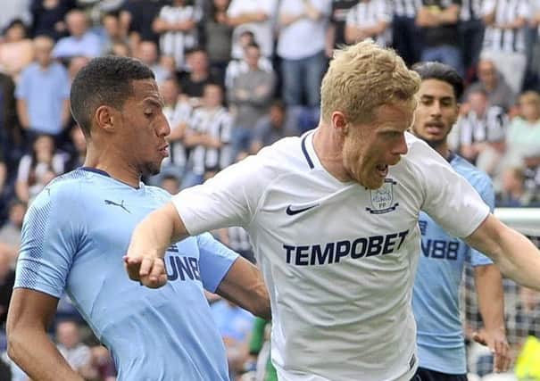 Daryl Horgan rides a challenge in PNE's clash with Newcastle