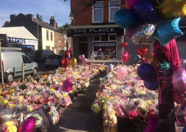 Flowers and cards outside The Plaice after the Manchester attack