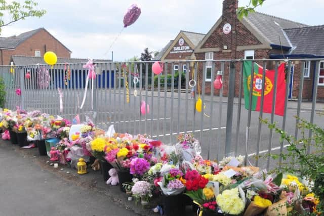 Flowers laid at Tarleton Community Primary School, Tarleton, in the wake of the bombing in May