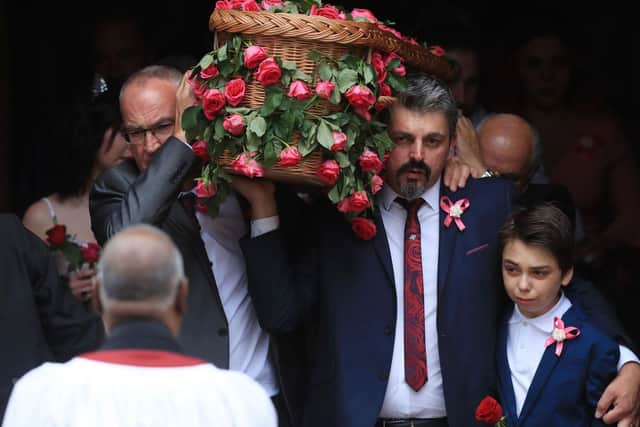 Dad Andrew Roussos, 43, and brother Xander hold the coffin of Saffie Roussos