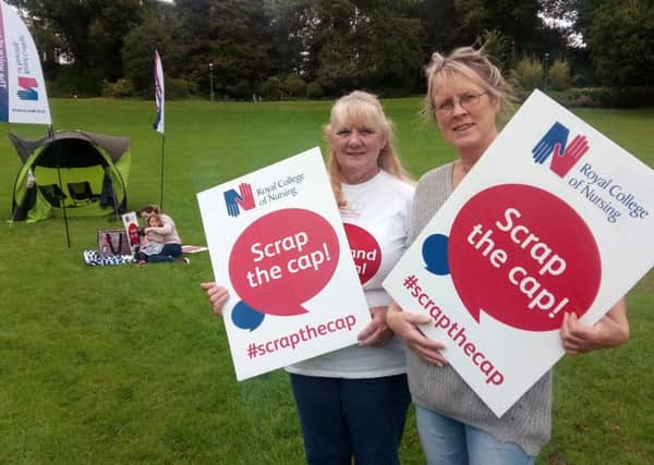 Photo Neil Cross
Maggy Heaton and Helen Taylor of Royal College of Nursing holding a protest picnic on Avenham Park