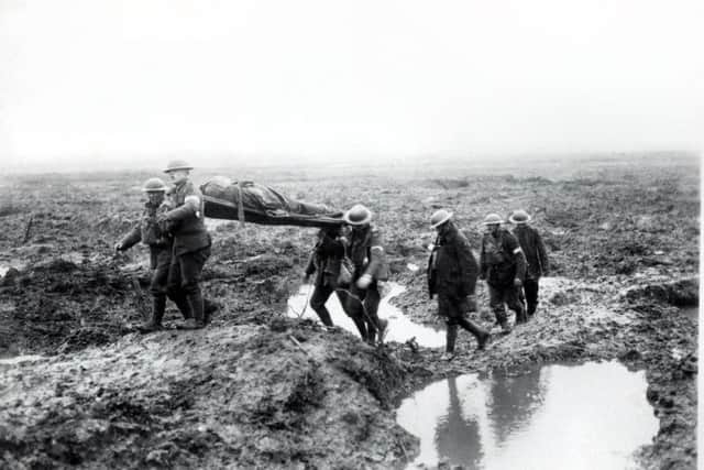 Wounded Canadians on way to aid-post during the Battle of Passchendaele