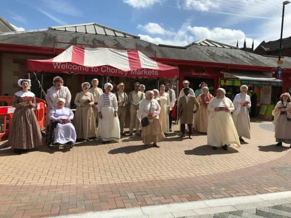 Some members of The Church of Jesus Christ of Latter-day Saints, performed at Chorley Market ahead of their performance of The British Pageant at the Pageant Theatre