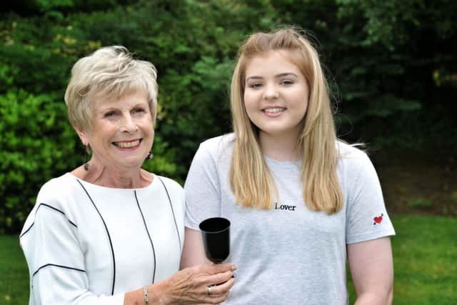 Oldest member Marcia Mallett (73) and youngest member Rebecca Barnes-Hudson (13)