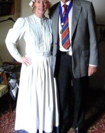 Joanne Halliwell as 'Betsy the Scullery Maid' with Clitheroe and District Probus Club chairman Alan Daniels.