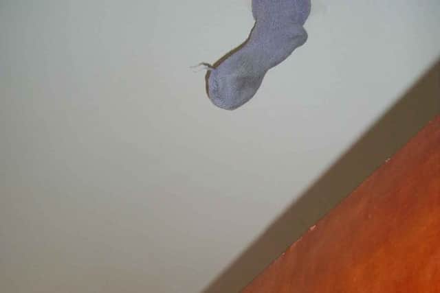 A sock covered one of the fire detectors in the bedroom.