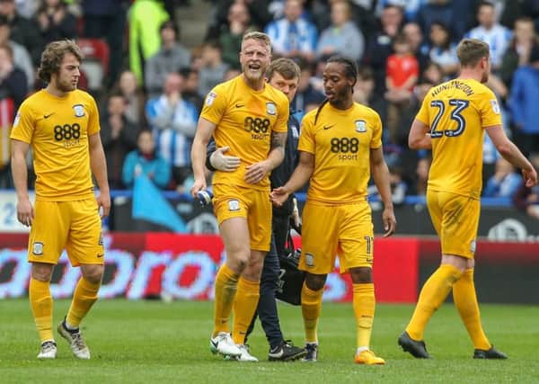 Preston North End's Tom Clarke leaves the field in painafter rupturing his Achilles tendon at Huddersfield last season