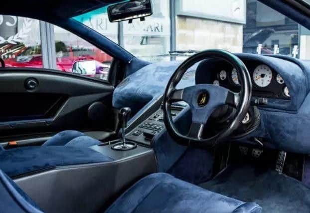Its interior is as eye-catching as the bodywork, boasting blue suede everywhere.