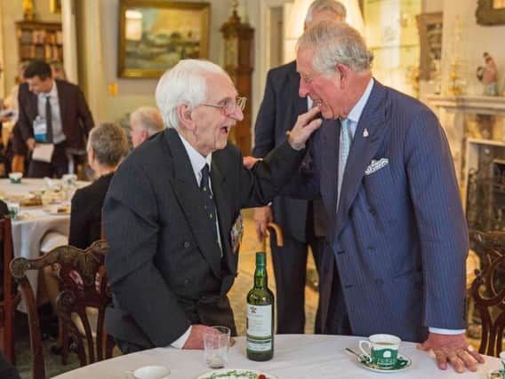 The Prince of Wales with veteran Flying Officer Ken Wilkinson, one of the last surviving Spitfire pilots from the Battle of Britain, who has died
